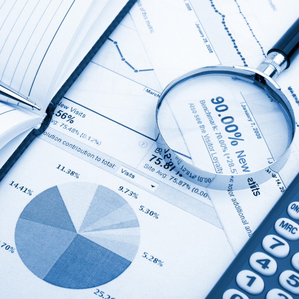 Pen, Magnifier and Calculator on Financial Statement